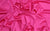 A rich fuchsia Italian satin swatch, designed for gloves inspired by Sarah Jessica Parker’s style and iconic fashion moments