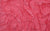 Close-up of pink jersey knit fabric, designed for sleek and timeless Tribeca gloves