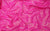 Neon pink sequin fabric, adding a playful yet glamorous touch to handmade gloves