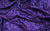 A deep purple sequin fabric, stretchy and reflective, used for Hollywood-inspired gloves.