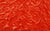 A red velour swatch with a rich texture, made for luxurious and dramatic gloves