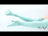 video of model wearing light blue satin gloves