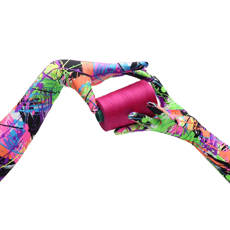 vibrant 80s graffiti print opera length spandex gloves holding a pink spool of thread